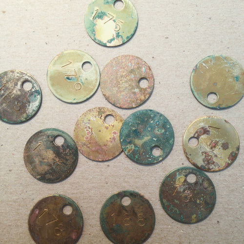 Patinated and stamped brass zipper pulls