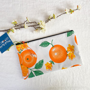 Small oilcloth pouch with color variations